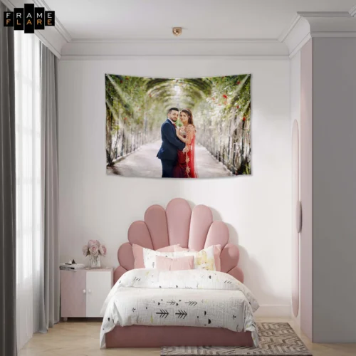 A beautiful bed room whose hangs a tapestry on the wall